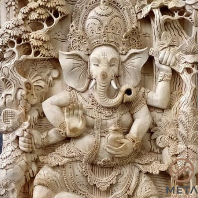 This wooden relief carving depicting the Hindu God Ganesha is truly one of a kind piece of artwork. If you crave a piece of unique, alluring, and beautiful art, this piece is for you. This piece is incredibly ornate and will look equally as lovely mounted on a wall or placed on a bookshelf.